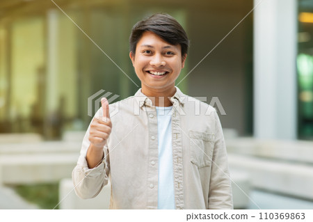 Positive young asian entrepreneur showing thumb up 110369863