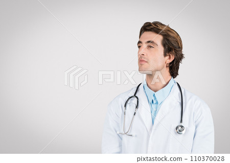 Thoughtful caucasian male doctor in white coat with stethoscope 110370028