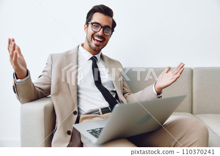 Sofa man business communication video couch laptop online smiling call home networking Sofa man business communication video couch laptop online smiling call home networking 110370241