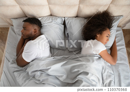 Black Couple Turning Backs To Each Other Lying In Bed Black Couple Turning Backs To Each Other Lying In Bed 110370368