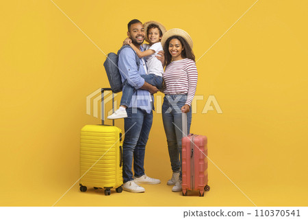 Family Trip Concept. Happy African American Parents Travelling With Their Little Son Family Trip Concept. Happy African American Parents Travelling With Their Little Son 110370541