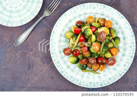 Vegetable salad with Brussels sprouts. 110370595