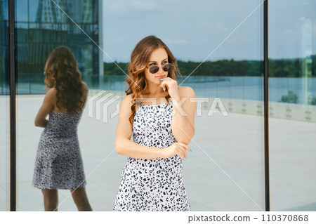 Urban portrait of pensive woman Urban portrait of pensive woman 110370868