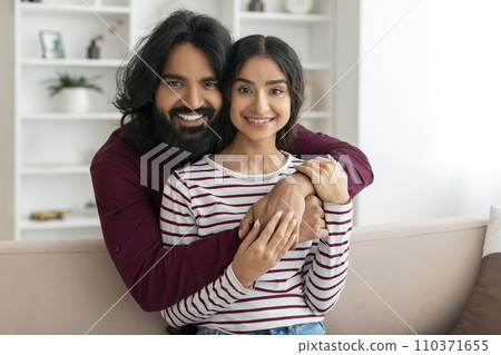 Family portrait of happy beautiful millennial indian couple 110371655