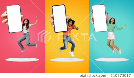 Amazing Offer. Excited Young People Jumping With Big Blank Smartphone In Hand 110373017