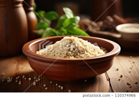 Quinoa in bowl on wooden kitchen table. Quinoa in bowl on wooden kitchen table. 110374966