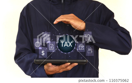 Young man using the iPad to show TAX for Individual income tax return forms online for tax payment. 110375062