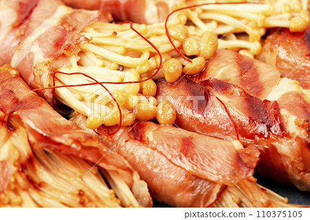 Enoki mushroom appetizer fried in bacon Enoki mushroom appetizer fried in bacon 110375105