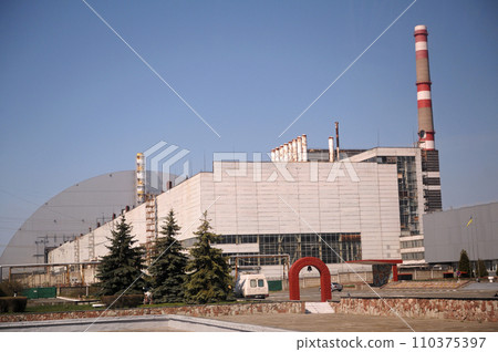 Building of a block of the Chornobyl Nuclear Power Plant, ChNPP, New Safe Confinement on a background. Ukraine Building of a block of the Chornobyl Nuclear Power Plant, ChNPP, New Safe Confinement on a background. Ukraine 110375397