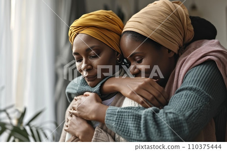 A family embracing, offering support to a member battling cancer, symbolizing love and care. World Cancer Day 110375444