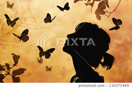 Silhouette of a person looking up to the sky, with several butterflies flying around, symbolizing transformation and hope. Concept of overdose,Overdose Awareness Day 110375469