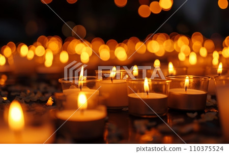 A candle vigil with many lit candles, symbolizing remembrance and hope for those affected by cancer.World Cancer Day A candle vigil with many lit candles, symbolizing remembrance and hope for those affected by cancer.World Cancer Day 110375524