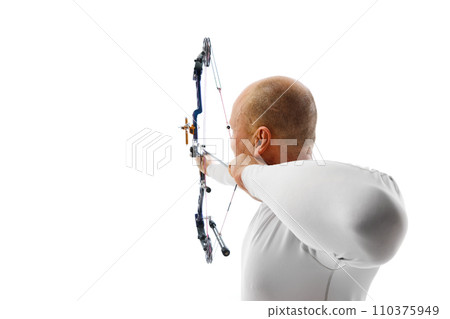 Back view image of man, archery at hele aiming with archery bow on target isolated over white studio background. Archery sport, competition Back view image of man, archery at hele aiming with archery bow on target isolated over white studio background. Archery sport, competition 110375949
