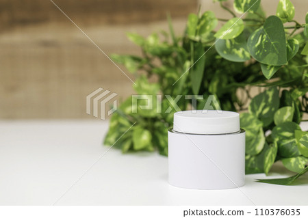 white cream container and green 110376035