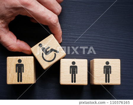 Supported Employment and inclusion. Cubes with employees and hand holding with disabled person sign. 110376165