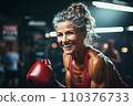 Portrait of athletic gray hair woman working out in gym . Fitness and bodybuilding concept 110376733