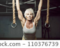 Portrait of athletic gray hair woman working out in gym . Fitness and bodybuilding concept 110376739