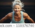 Portrait of athletic gray hair woman working out in gym . Fitness and bodybuilding concept 110376740