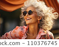 Portrait of beautiful smiling mature woman with long gray hair wearing sunglasses 110376745