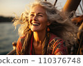 Portrait of beautiful smiling mature woman with long gray hair 110376748