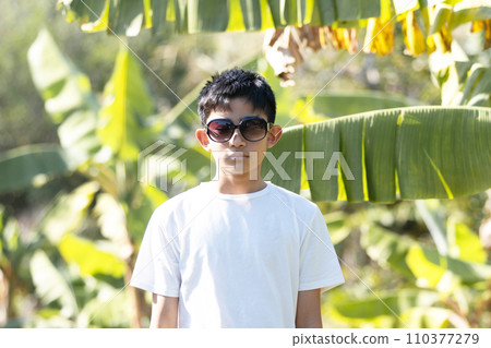 A boy with sunglasses 110377279