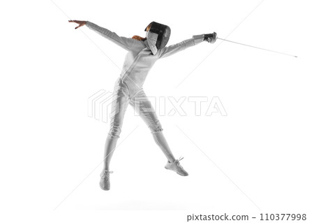 Skilled fencer executing graceful parry, concentration evident in her moves against neutral white studio background. Mental aspect of sport. Skilled fencer executing graceful parry, concentration evident in her moves against neutral white studio background. Mental aspect of sport. 110377998