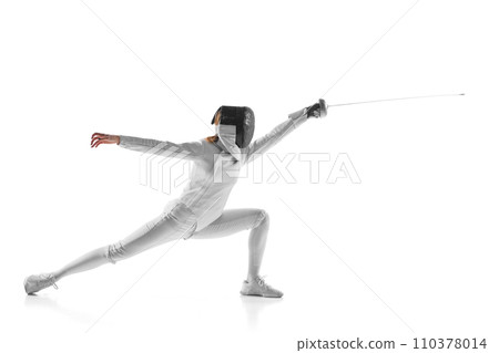 Artistry and combat. Electrifying photo of finesse of female fencer in motion, sword gleaming, against white studio background. Artistry and combat. Electrifying photo of finesse of female fencer in motion, sword gleaming, against white studio background. 110378014