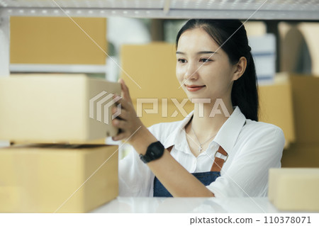 Happy entrepreneurs using tablets for check order and Checking stock for delivering products to customers. Happy entrepreneurs using tablets for check order and Checking stock for delivering products to customers. 110378071