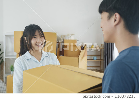 Asian young happy new married couple moving to their new house or real estate. 110378233