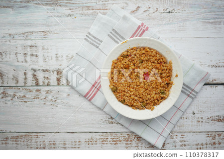 bulgur rice with tomato on a plate , 110378317