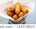 Crispy Tequenos in Serving Basket, Venezuelan fried street food dough with cheese 110378621