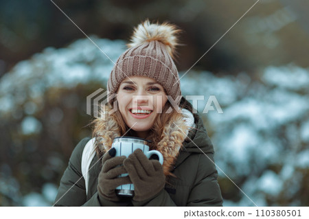 happy 40 years old woman outdoors in park in winter 110380501