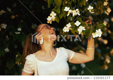 happy elegant female in white shirt with eyeglasses happy elegant female in white shirt with eyeglasses 110381177