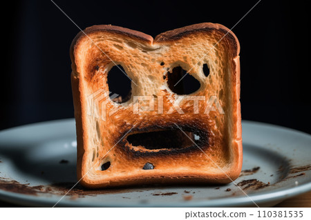 Burnt toast with an angry face expressing the emotion of sadness or sarcasm. Burnt toast with an angry face expressing the emotion of sadness or sarcasm. 110381535