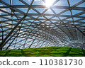 glass roof under the open sky with sun glare, indoor safety park with green hill lit by sunlight, nobody. 110381730