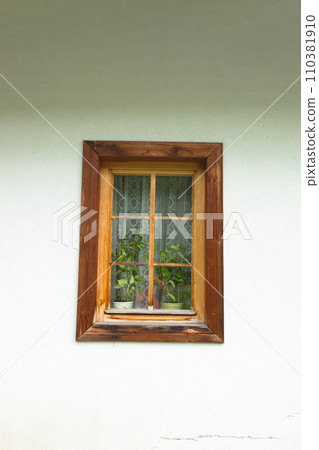 One old window with wooden frame, a fragment of the facade of an old building in Tatra Mountains, Poland. High quality photo One old window with wooden frame, a fragment of the facade of an old building in Tatra Mountains, Poland. High quality photo 110381910