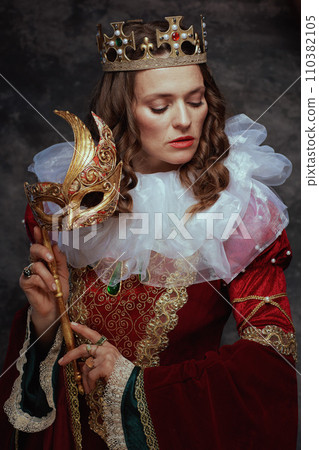 medieval queen in red dress with venetian mask medieval queen in red dress with venetian mask 110382105