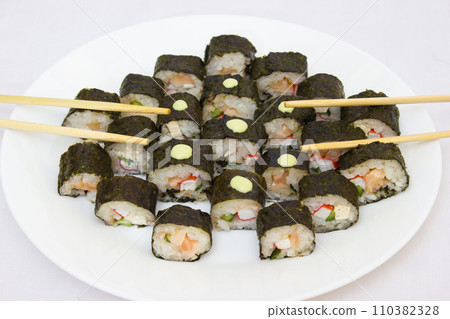 Japanese cuisine, rice sushi and fish - closeup Japanese cuisine, rice sushi and fish - closeup 110382328