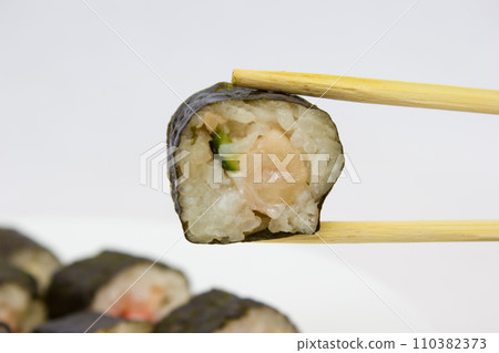 Japanese cuisine, rice sushi and fish - closeup Japanese cuisine, rice sushi and fish - closeup 110382373