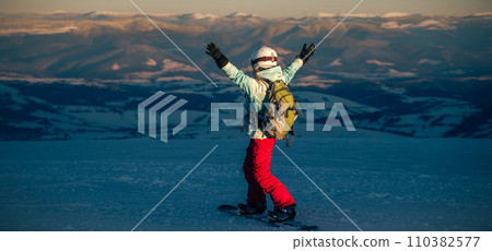 Young woman on the snowboard 110382577