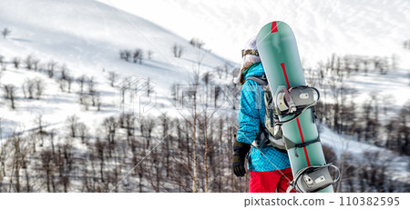 Young woman on the snowboard Young woman on the snowboard 110382595