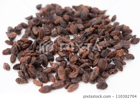 Dry raisins white background Dry raisins white background 110382704