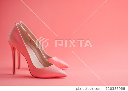 Pink female high heel shoes on pink background. Fashion, wedding, party and advertising concept. Elegant pink shoes, woman accessories, creative minimal background Pink female high heel shoes on pink background. Fashion, wedding, party and advertising concept. Elegant pink shoes, woman accessories, creative minimal background 110382966