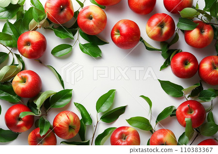 Frame of ripe red apples with leaves and fruit halves 110383367