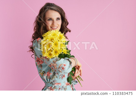 happy trendy woman with long wavy brunette hair on pink 110383475