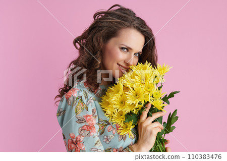 flirting stylish woman with long wavy brunette hair on pink 110383476