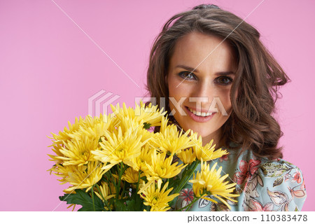 happy modern woman in floral dress on pink happy modern woman in floral dress on pink 110383478