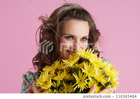 smiling woman in floral dress on pink smiling woman in floral dress on pink 110383484