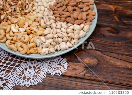 Different kinds of nuts. Walnuts almonds pistachios cashews peanuts 110383800