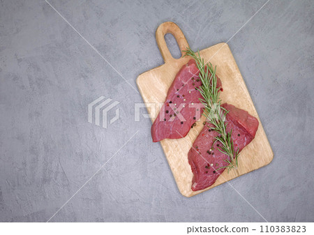 Fresh rib eye steak on wooden cutting board. Sliced beef steak Fresh rib eye steak on wooden cutting board. Sliced beef steak 110383823